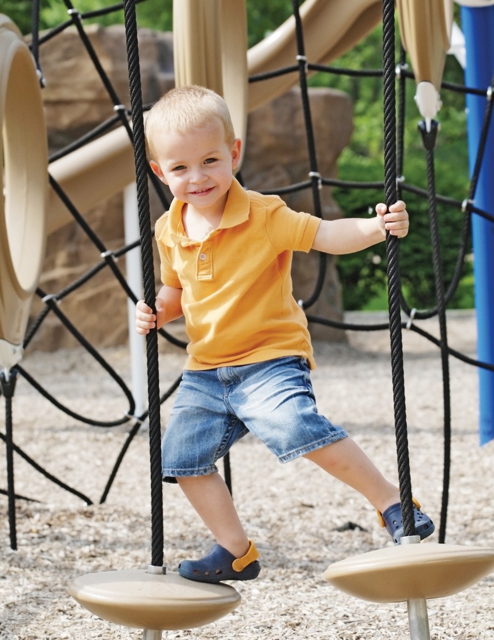 Image of child playing on obstacle course